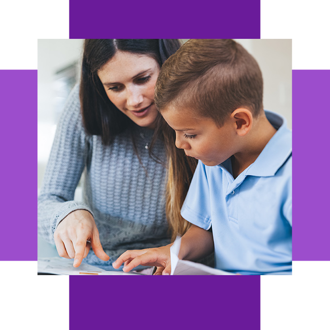 Mother and son looking at a Bible story lesson